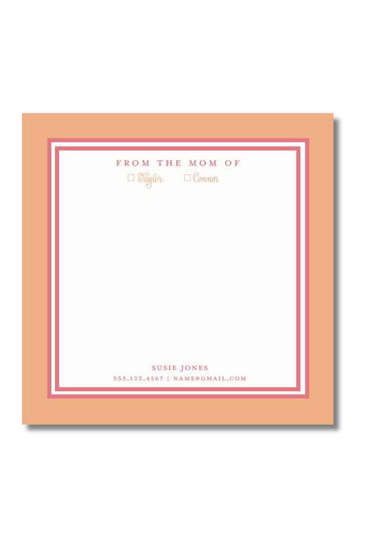 A square peach-colored notepad with a white writing area, bordered by pink double lines and small printed text at the top and bottom, shown on a light gray background.